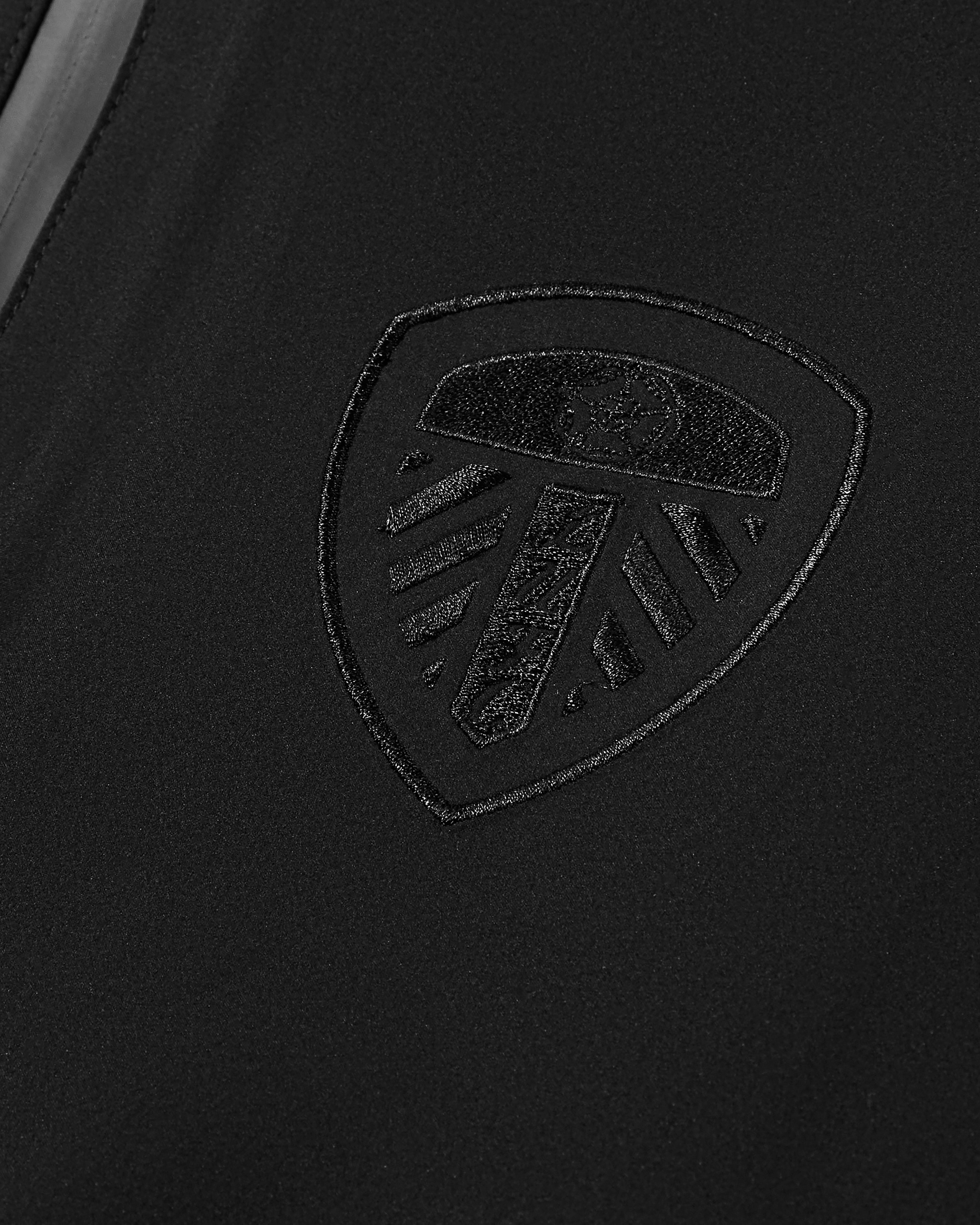 AOF Leeds United Shell Jacket | Black Coat | Art of Football